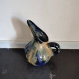 Old flamed sandstone pitcher