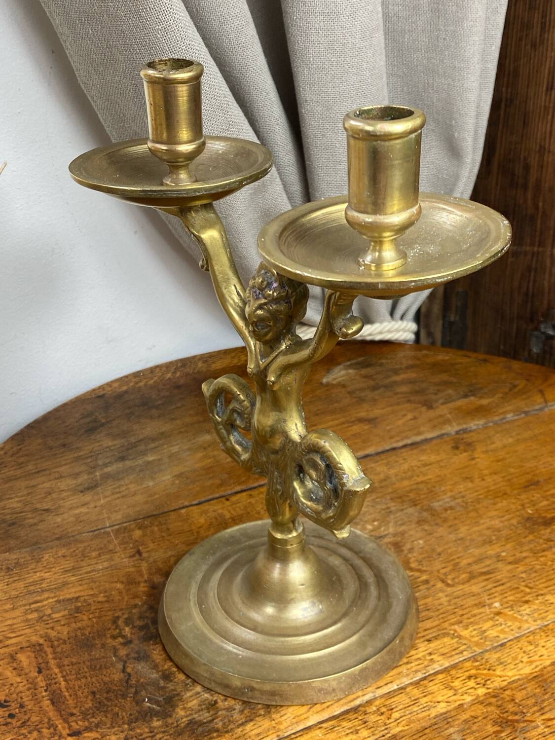 Mermaid-shaped chandelier in bronze