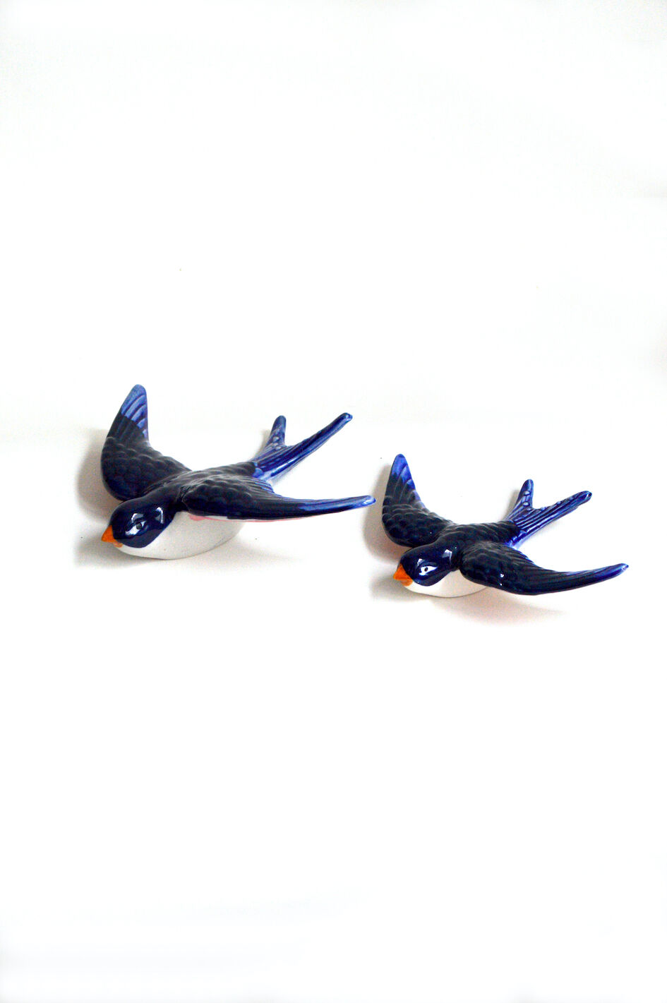 Couple of ceramic wall swallows