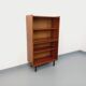Vintage wooden bookshelf in teak style from the 1960s.