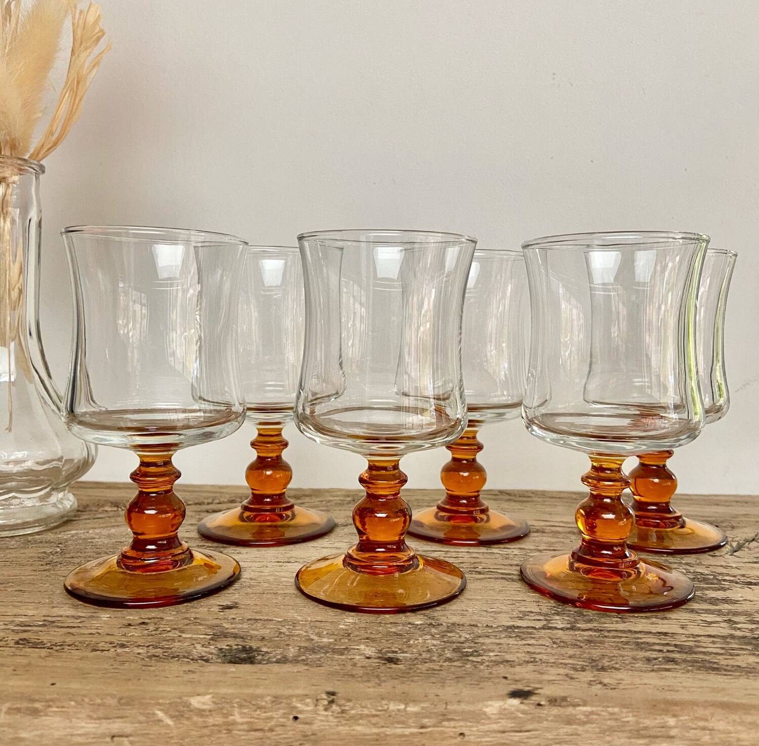 6 small amber stemmed glasses