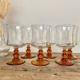 6 small amber stemmed glasses