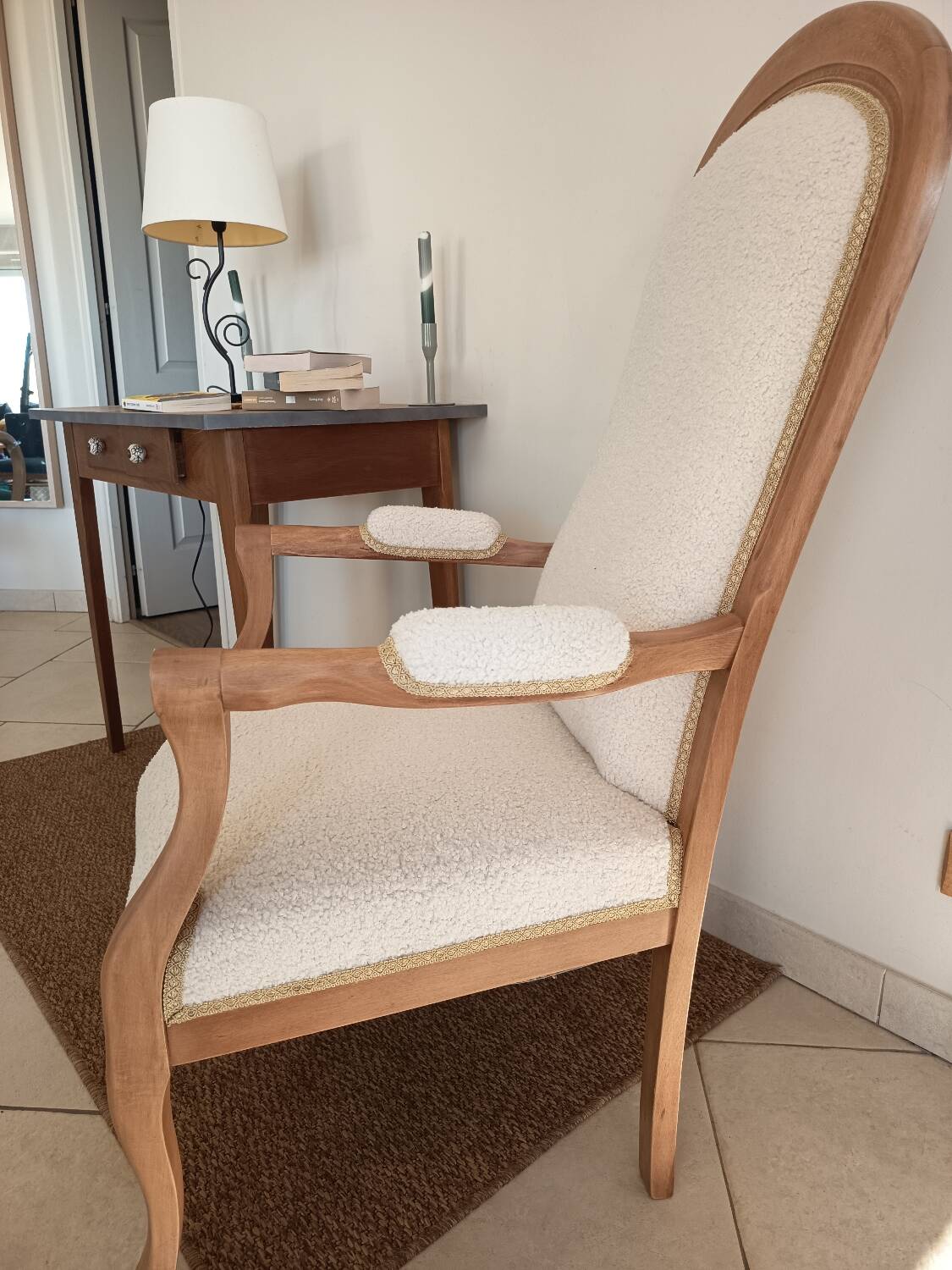 Renovated Voltaire armchair with boucle fabric.
