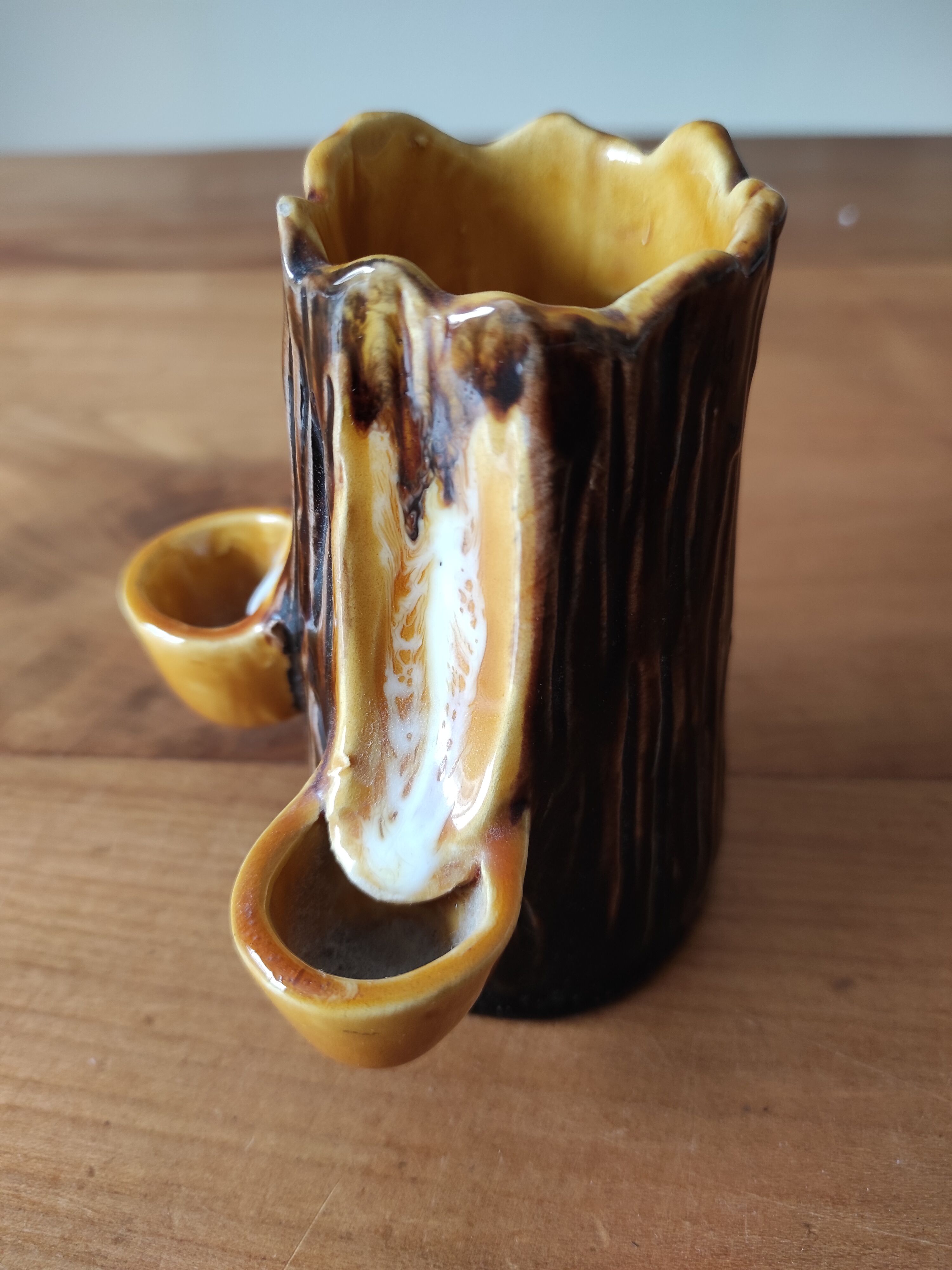 Ceramic vase with tree trunk decoration