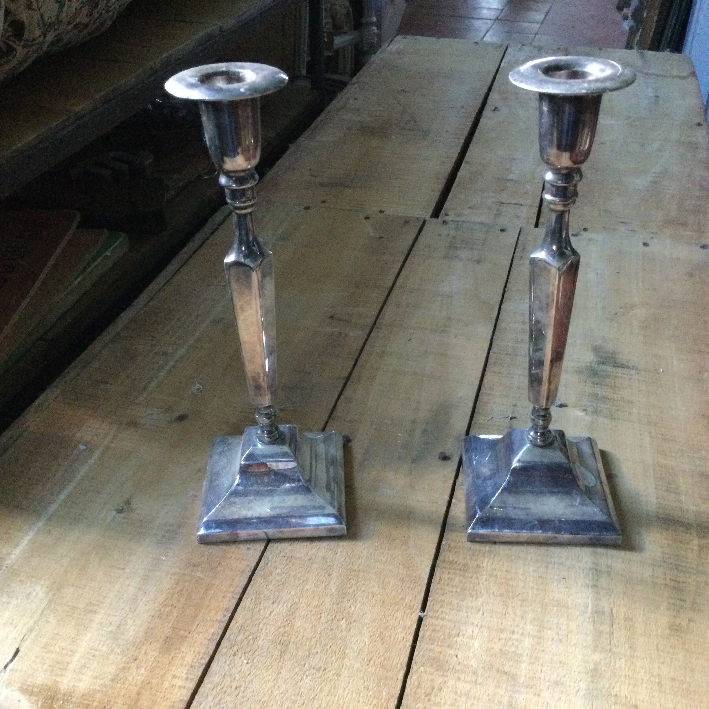 Pair of silver metal candle holders