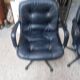 Pair of Comforto armchairs in black leather. Vintage 70s.