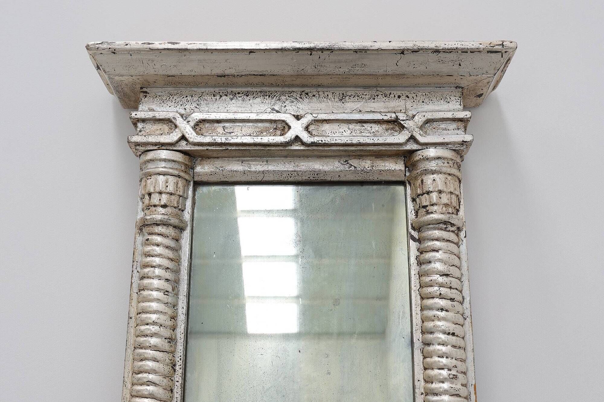 Pair of Neoclassical Silver Leaf Pier Mirrors with Ringed Columns and Corni