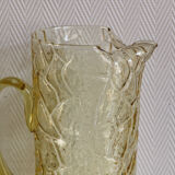 Pitcher in crumpled glass