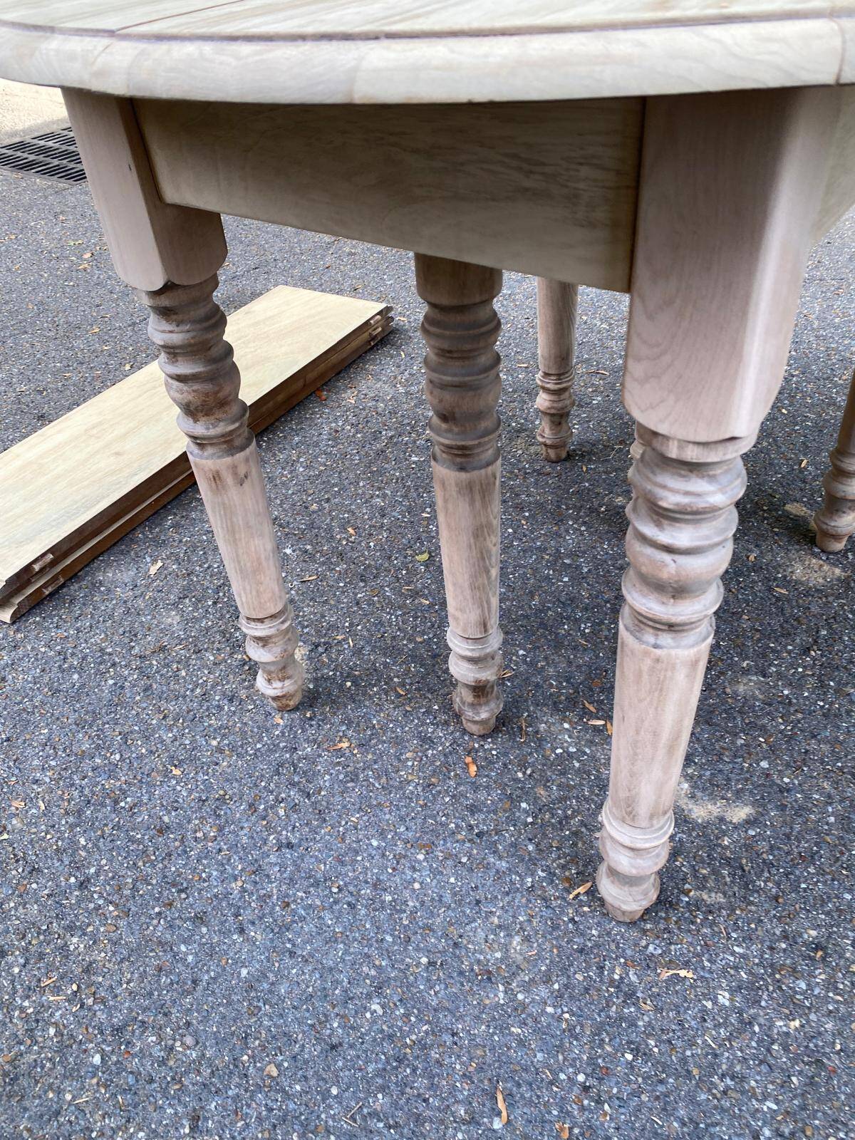 Round extendable dining table with flaps, stripped in raw oak, with 3 extensions.