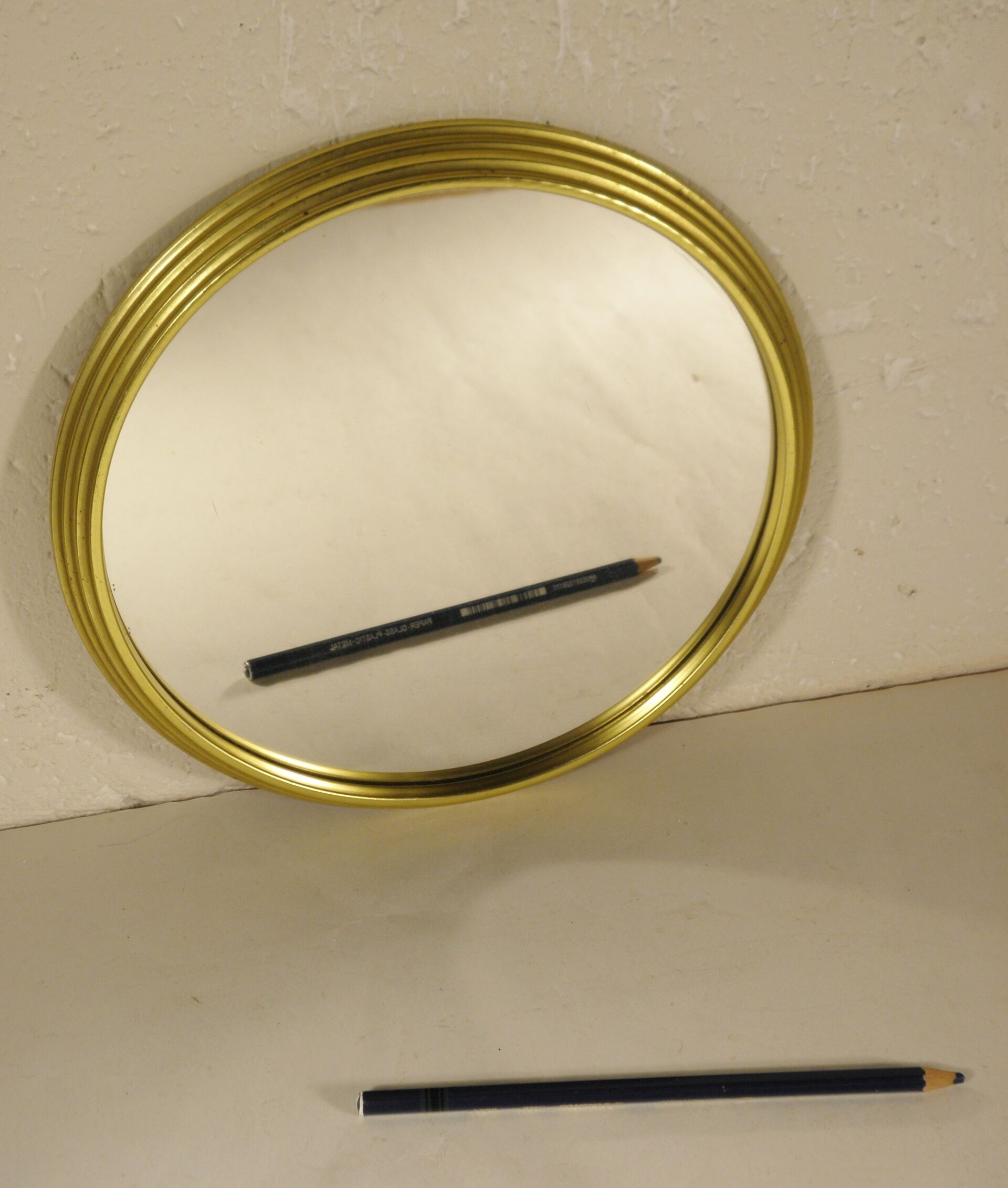Golden round mirror