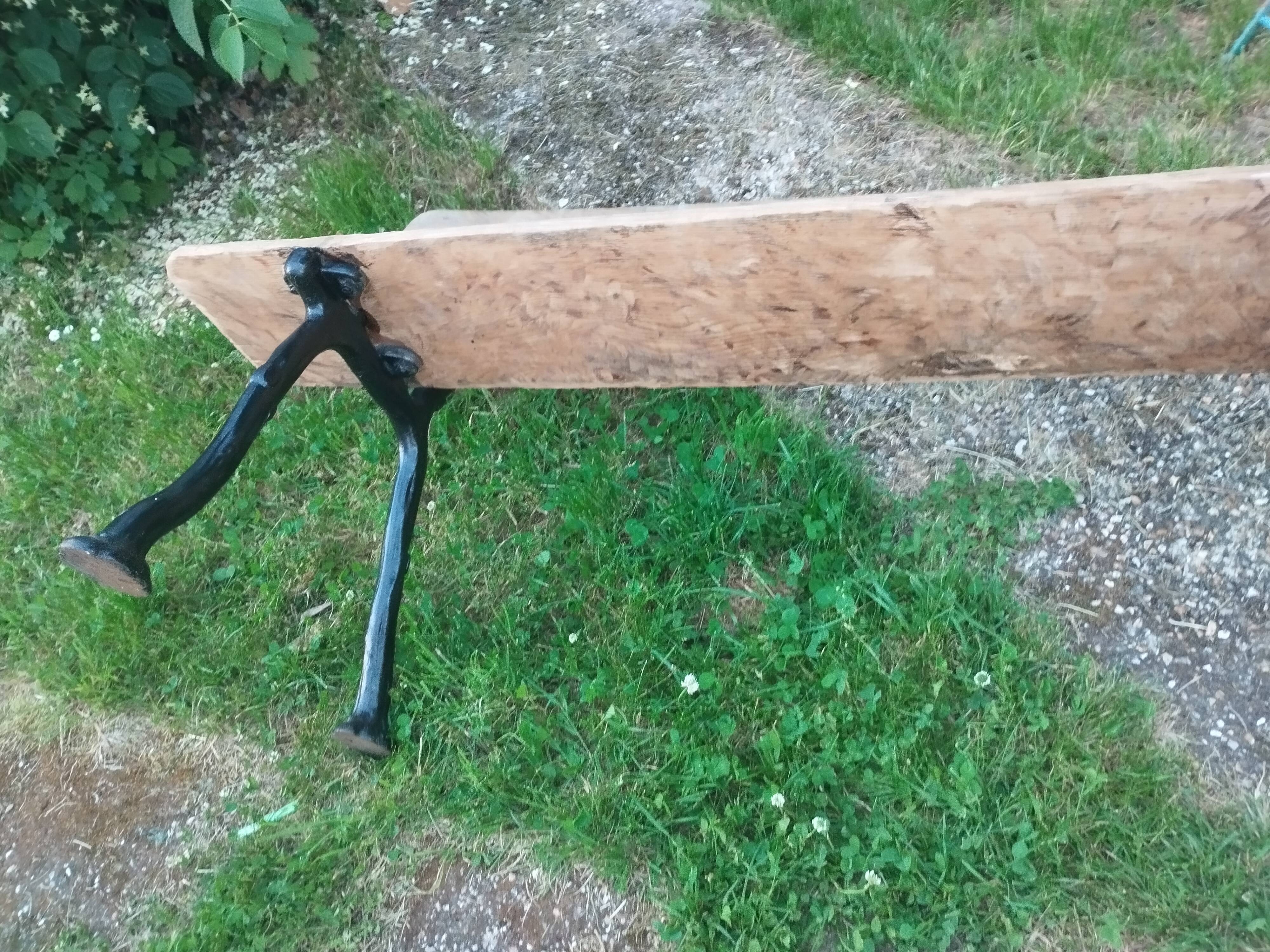 Antique garden bench with cast iron legs