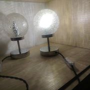 Duo of textured globe lamps with a large play of light.