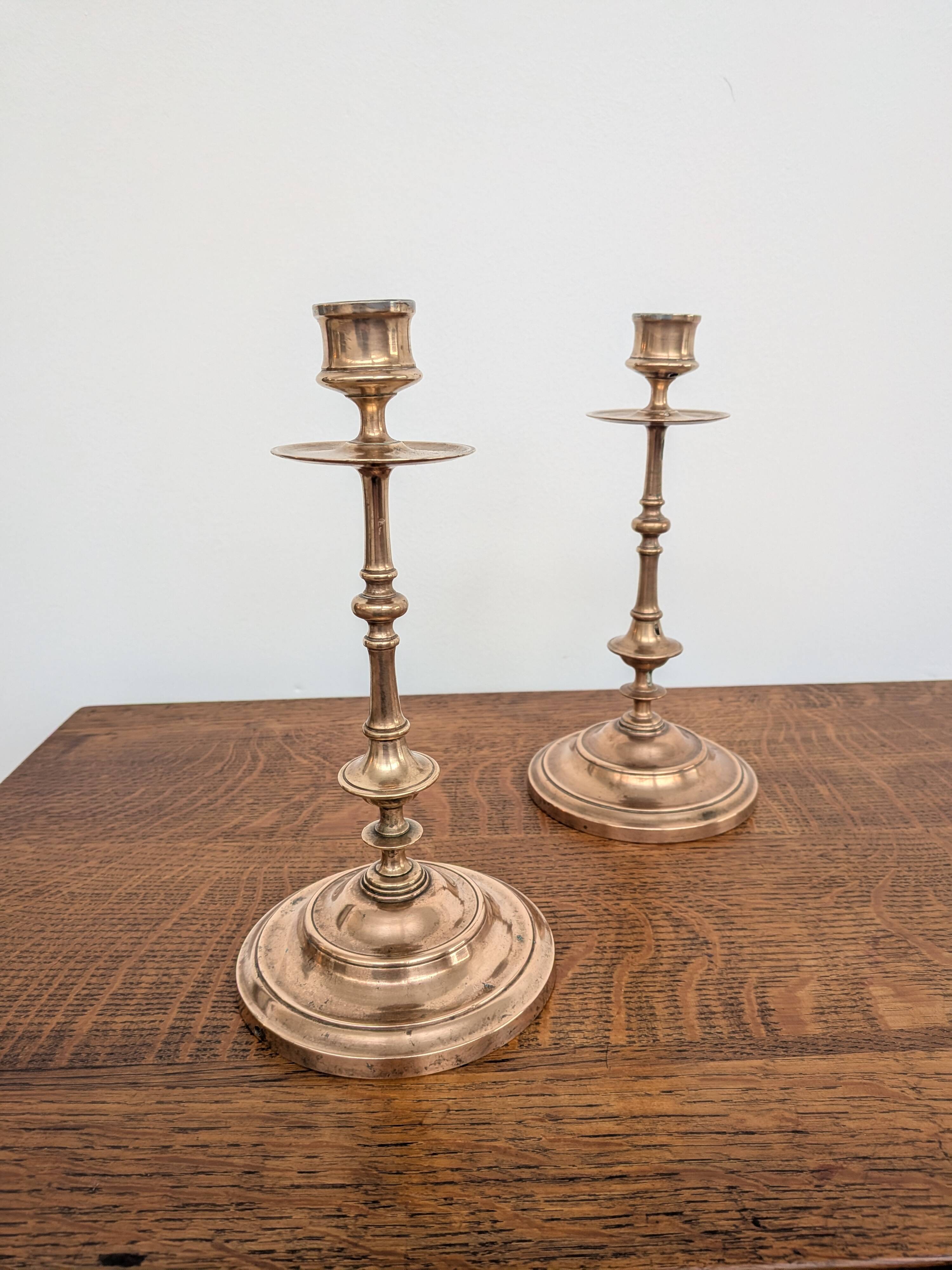 Pair of antique turned rose brass candlesticks (24 cm)