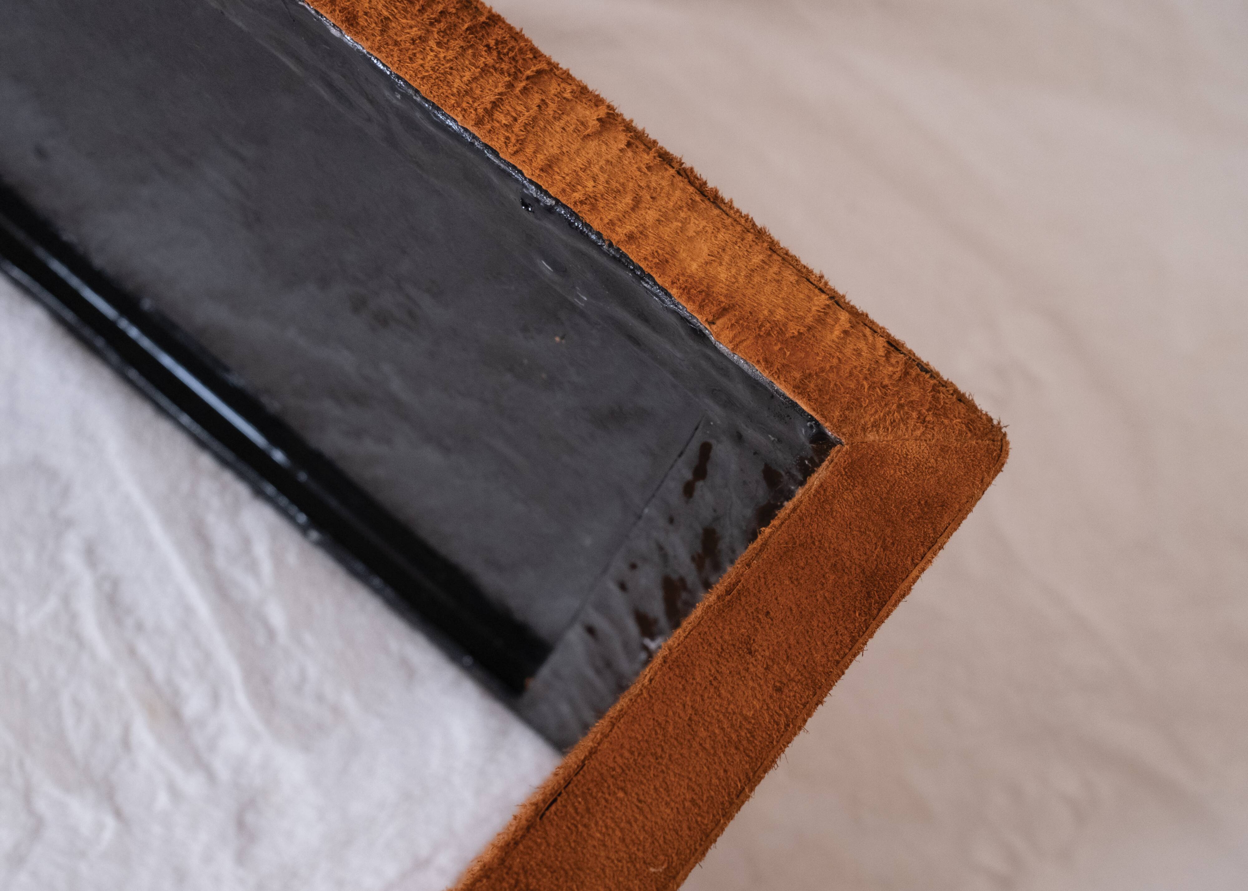 Pair of cognac suede side tables in the style of Jean Michel Frank.