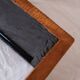 Pair of cognac suede side tables in the style of Jean Michel Frank.