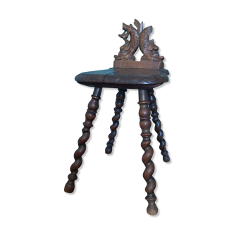 Antique stool in carved wood