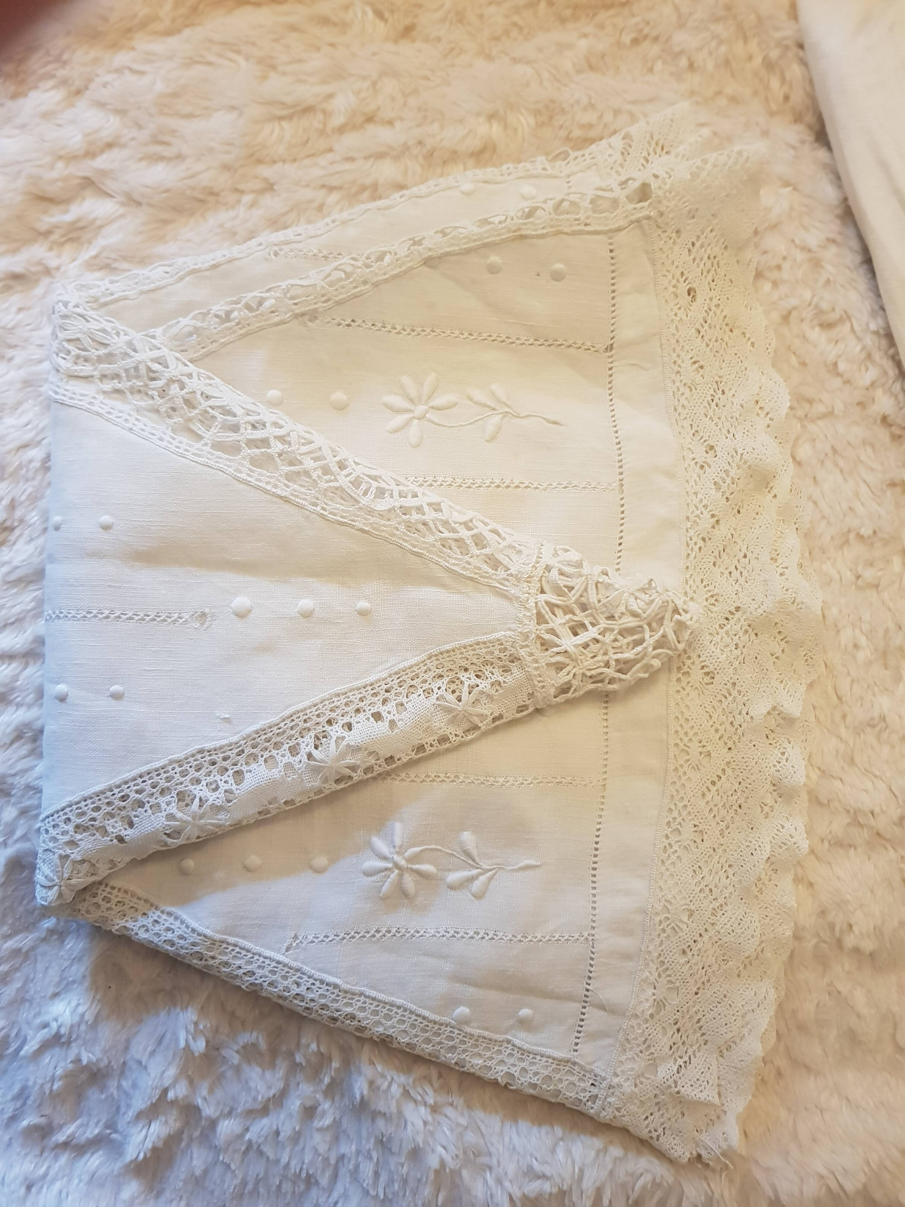 Round hand-embroidered linen tablecloth