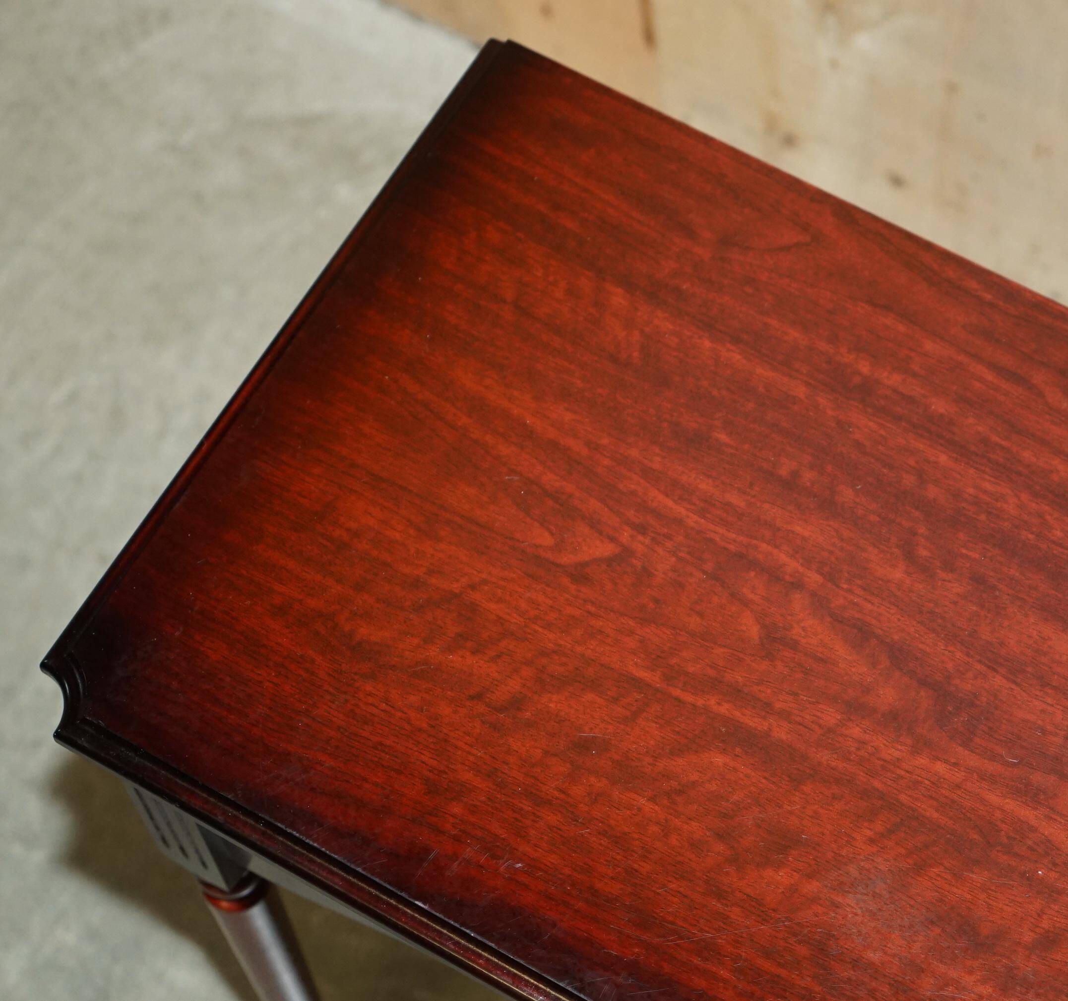 Small console with two drawers in hardwood finish.