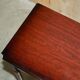 Small console with two drawers in hardwood finish.