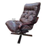 Scandinavian tilting and rotating armchair