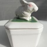 Pot terrine rabbit of Bavent in white earthenware on square of greenery