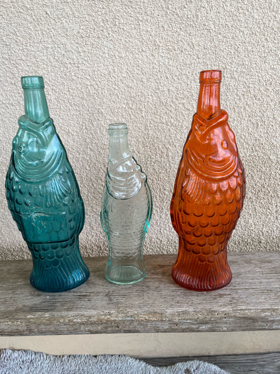 3 glass bottle fish