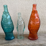 3 glass bottle fish
