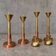 4 x Large / weighty postmodern candles / 1970s / two heights 60 - 70 cm / copper - brass