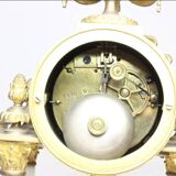 Clock and pair of Louis XVI style candelabras.