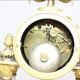 Clock and pair of Louis XVI style candelabras.