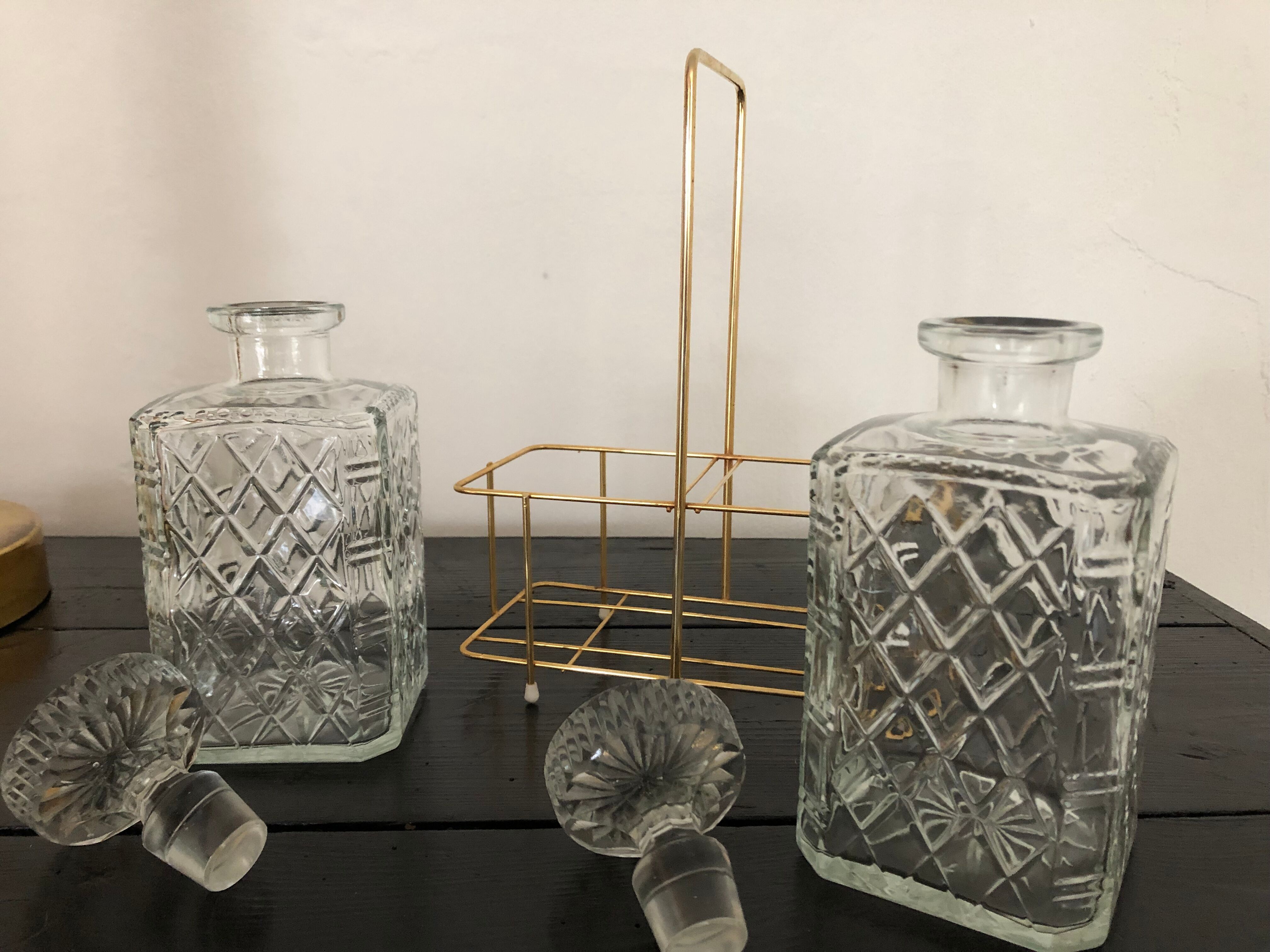 Pair of vintage decanters with brass basket