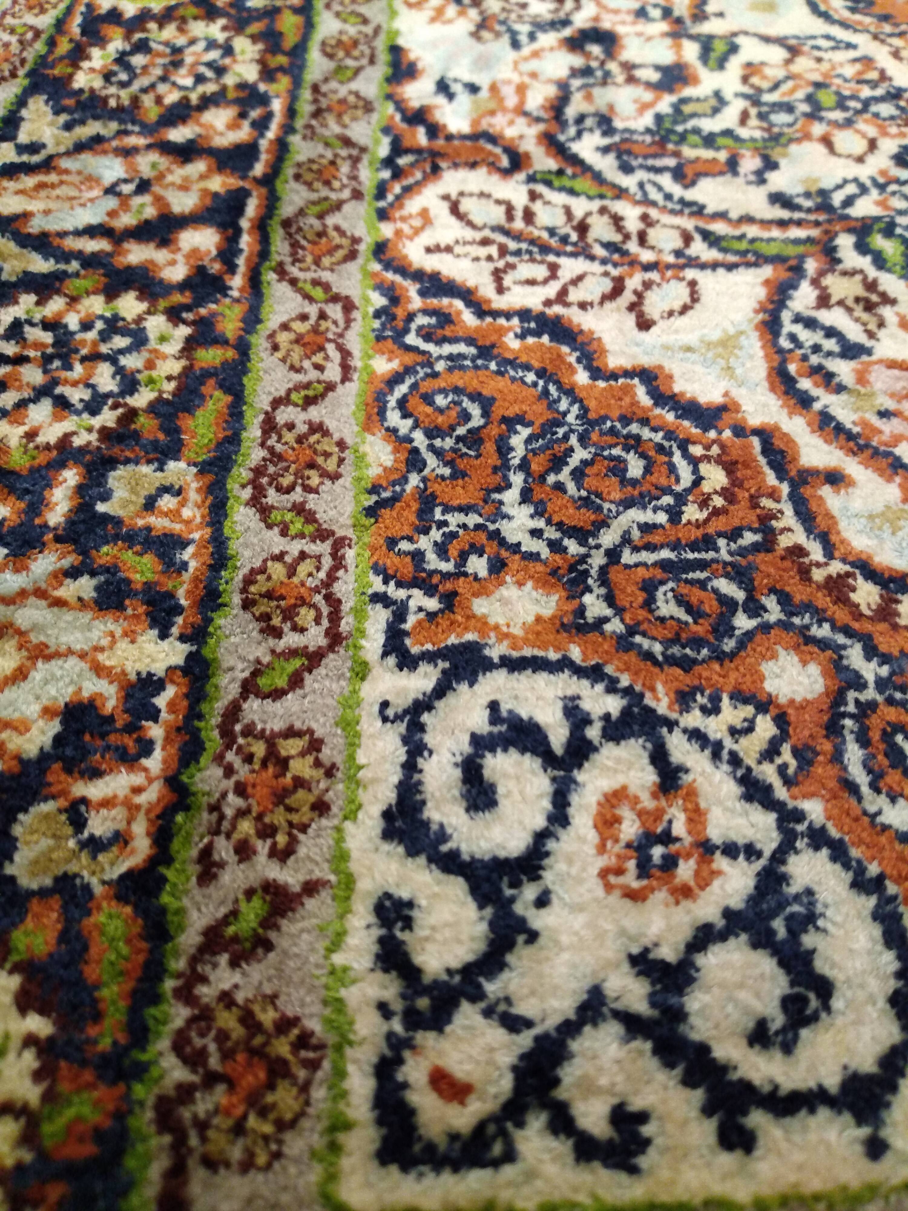 Handmade Persian wool and silk rug
