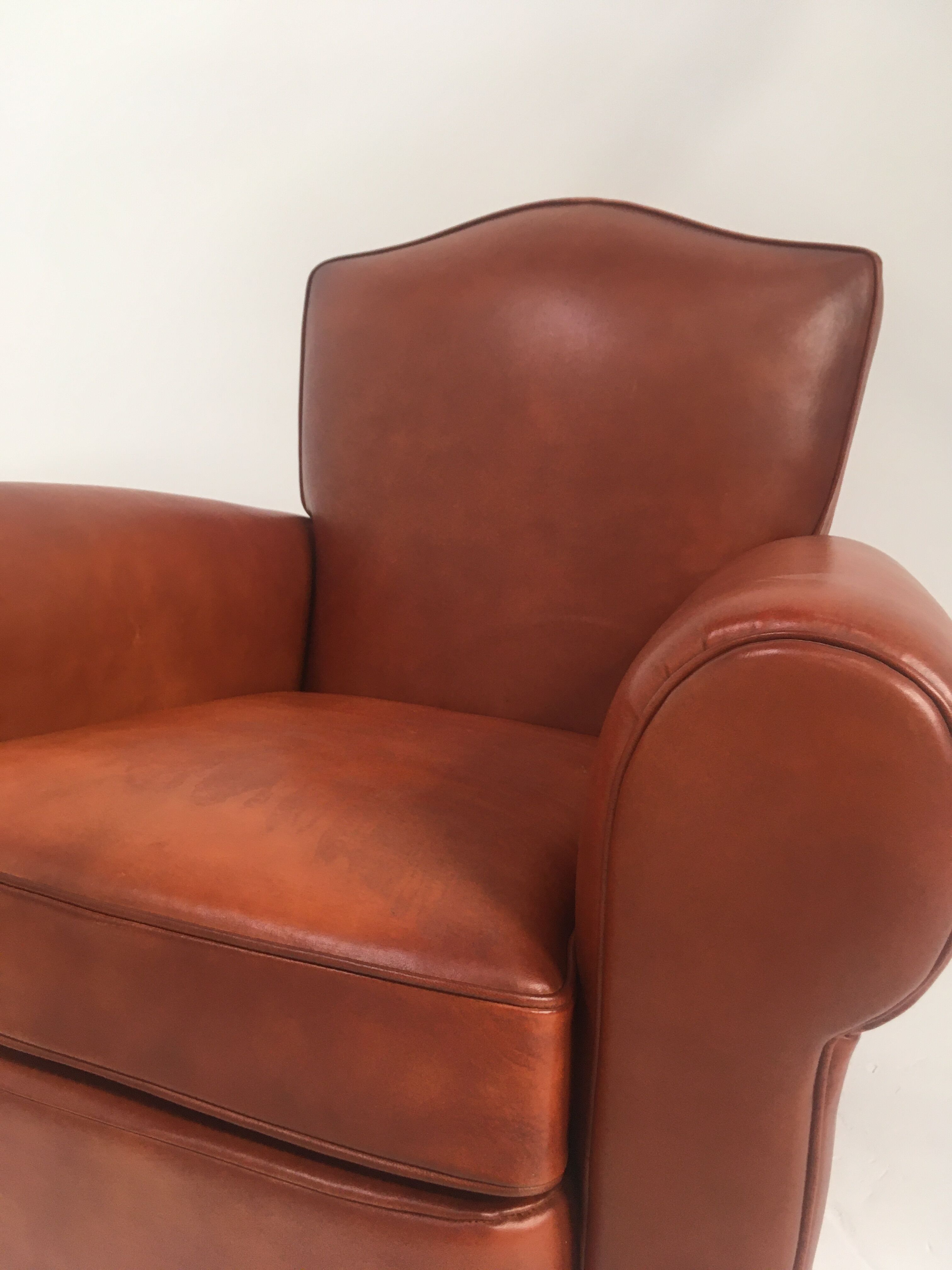 Large club chair in cognac leather