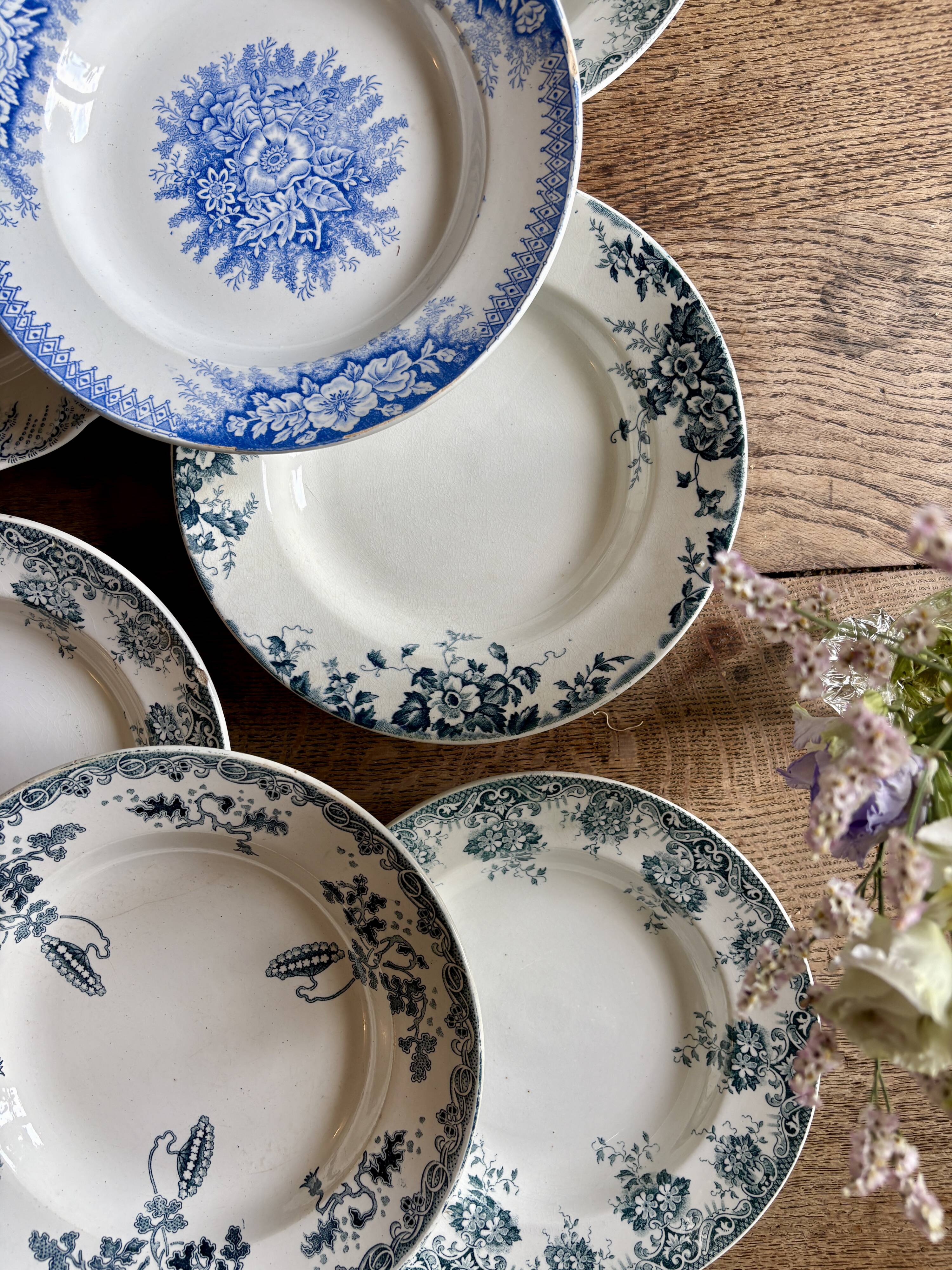 Set of 8 mismatched antique ironstone deep plates.