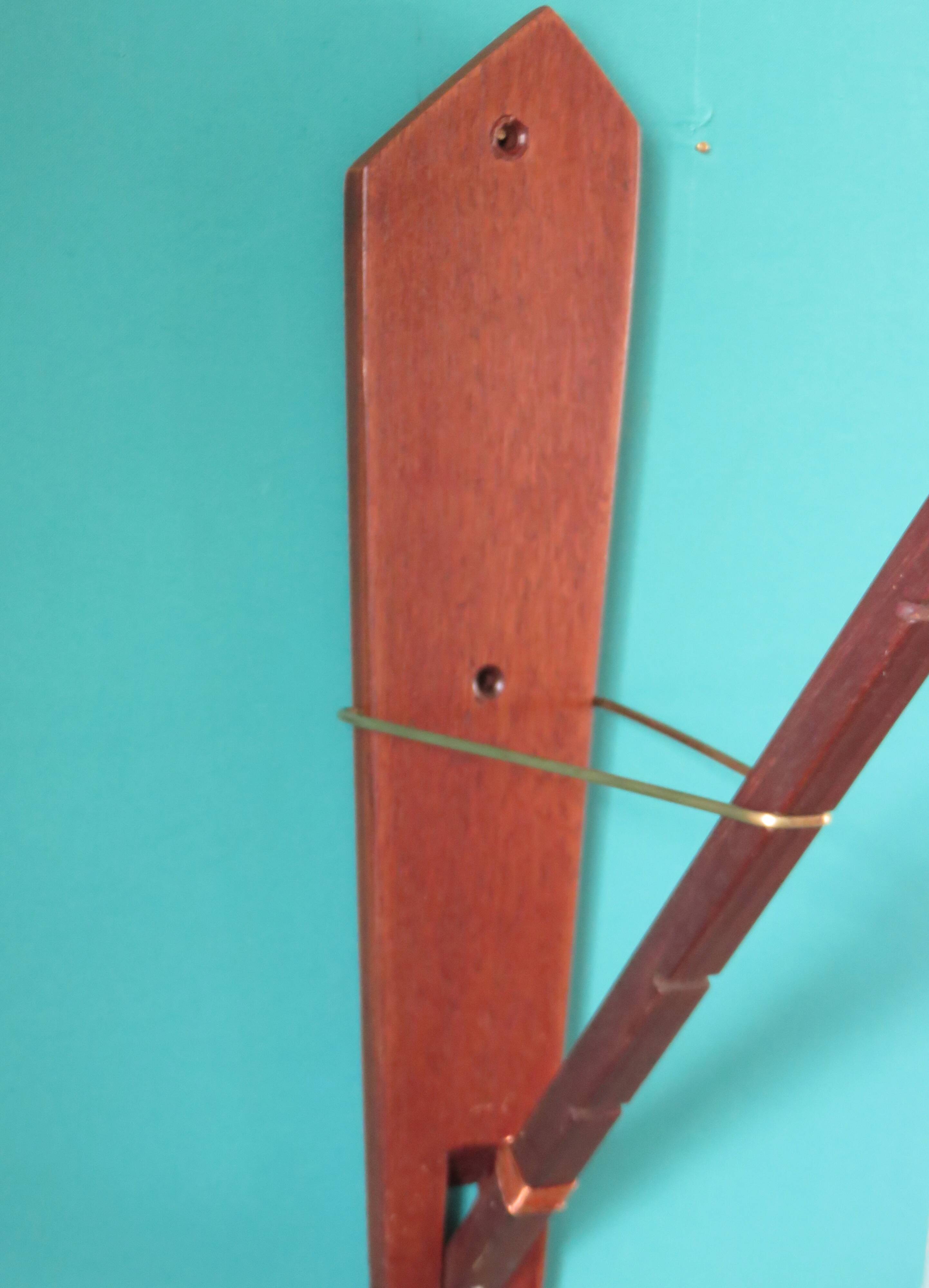Teak wall light with articulated arm. Denmark 1960