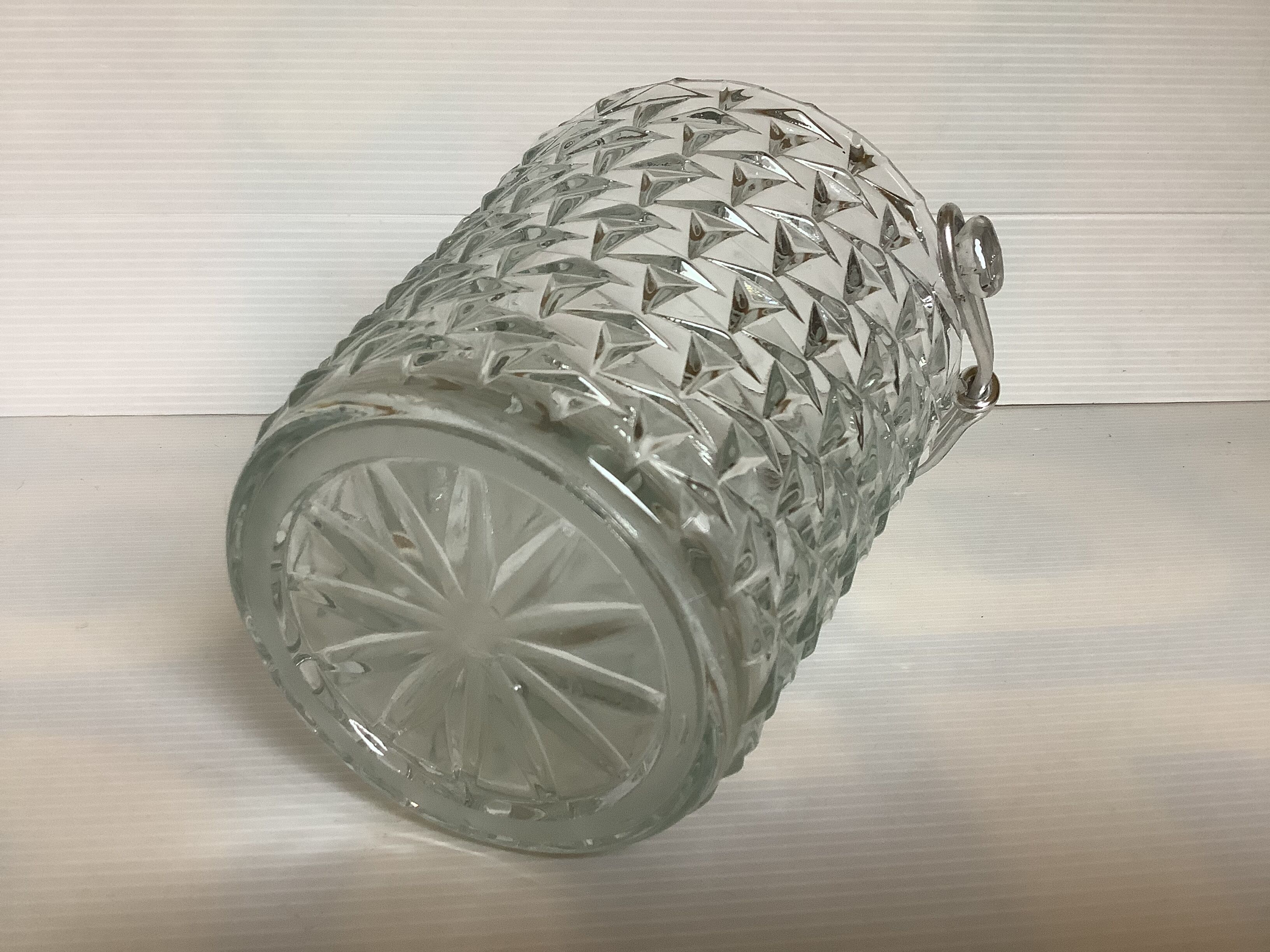 Geometric triangle patterned ice bucket in glass.