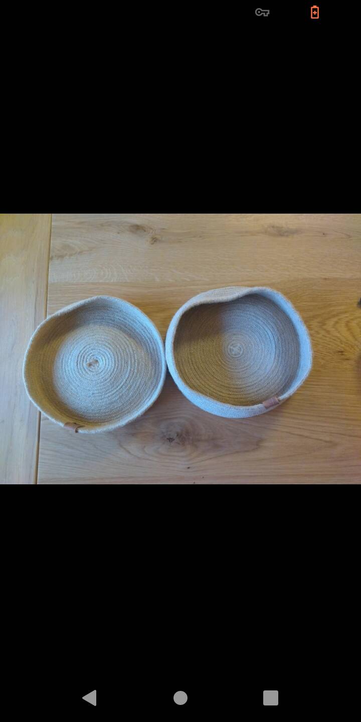 Basket with braided rope and leather lid