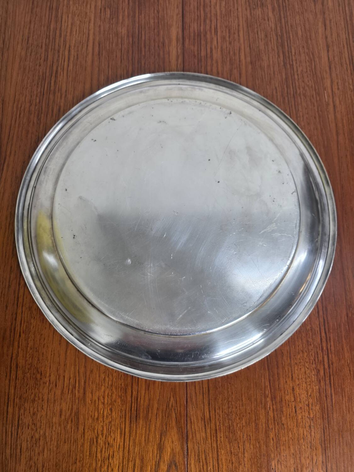 Round silver-plated metal tray from the mid-20th century
