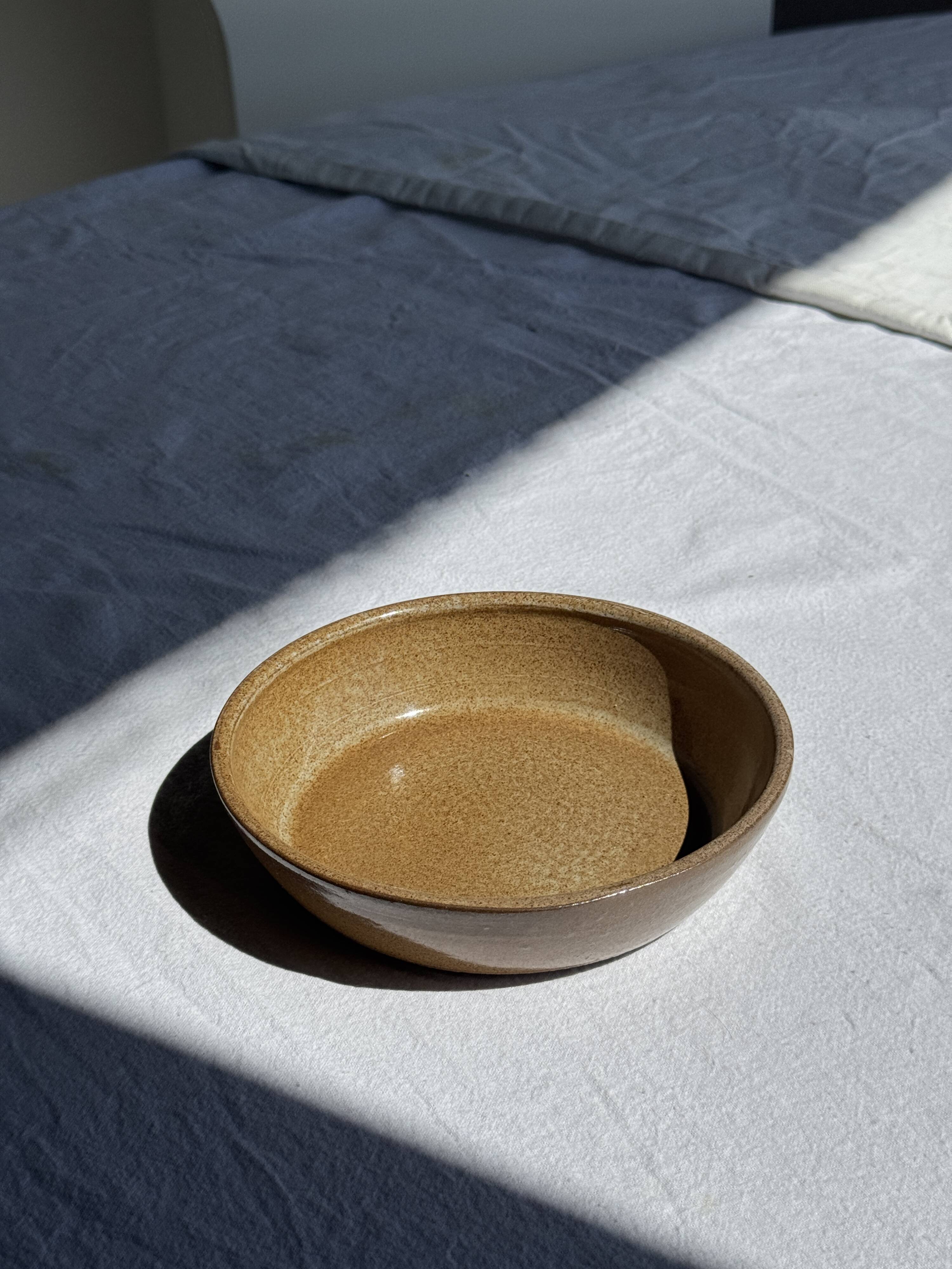 A solid brown flat-bottomed stoneware bowl D18