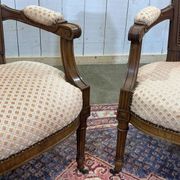 Paire de fauteuils Louis XVI début XXème en noyer