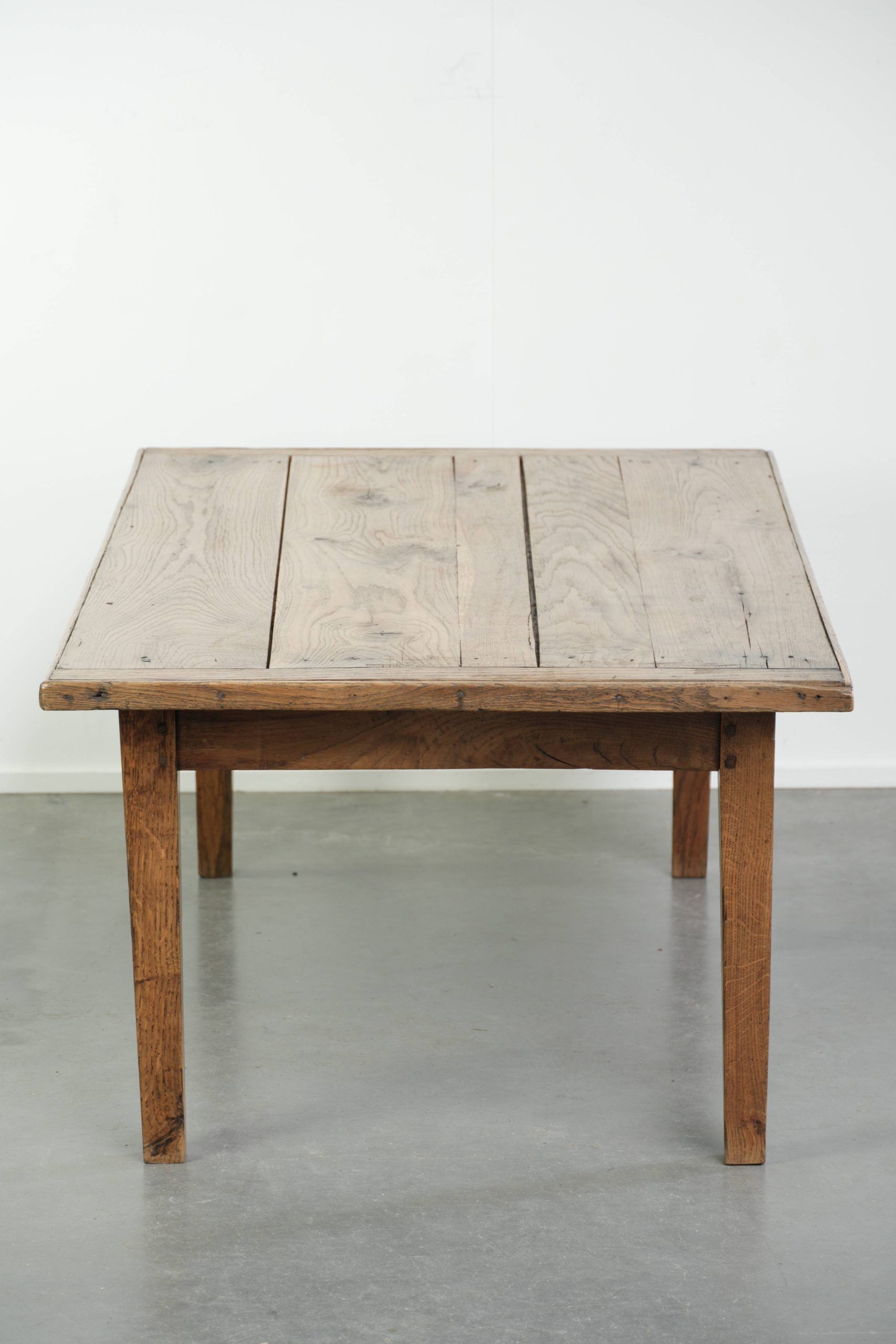 Antique pinewood coffee table with a drawer and a rural appearance