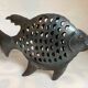Large metal fish-shaped candle holder