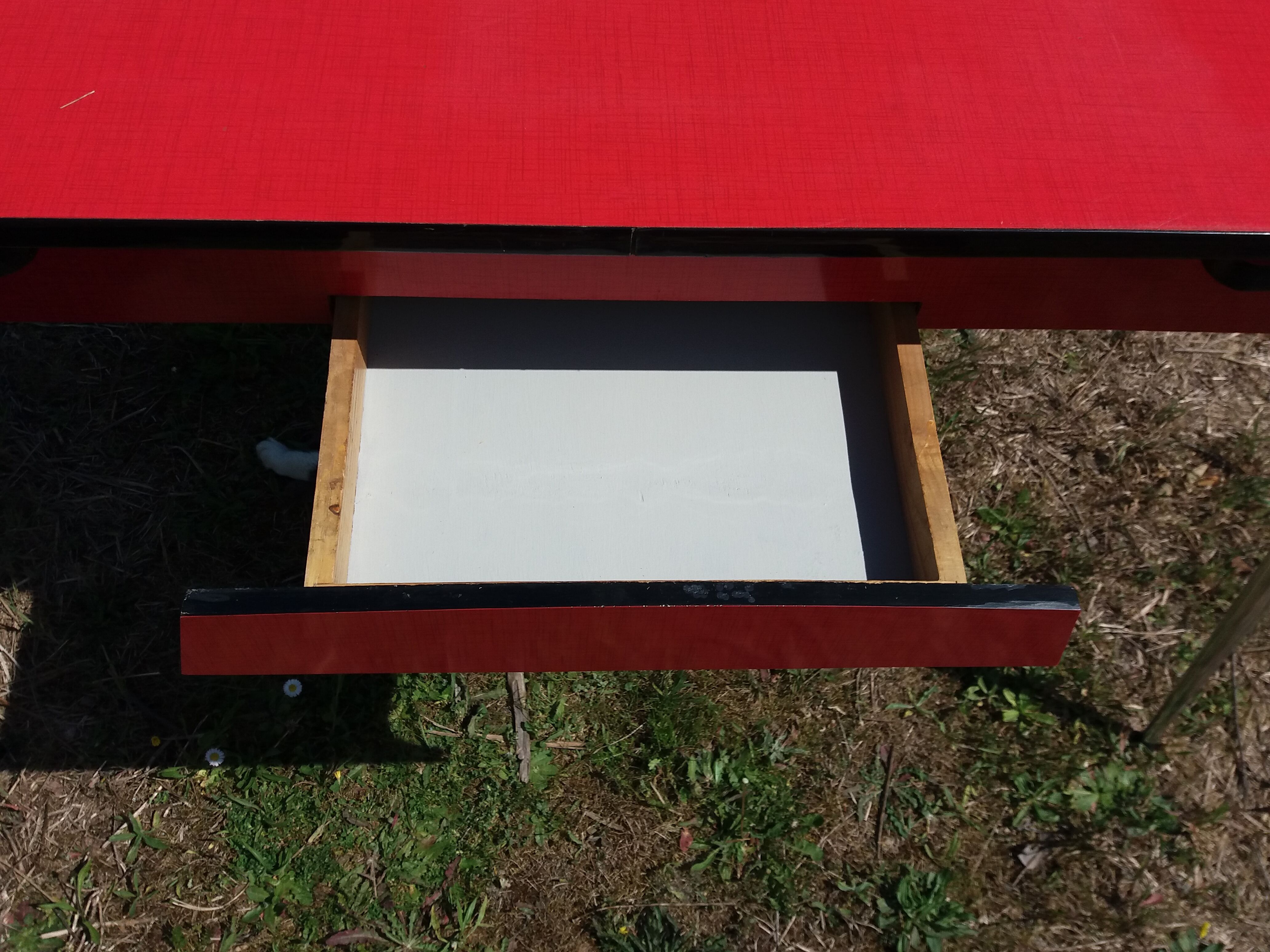 Dining table with red formica extensions