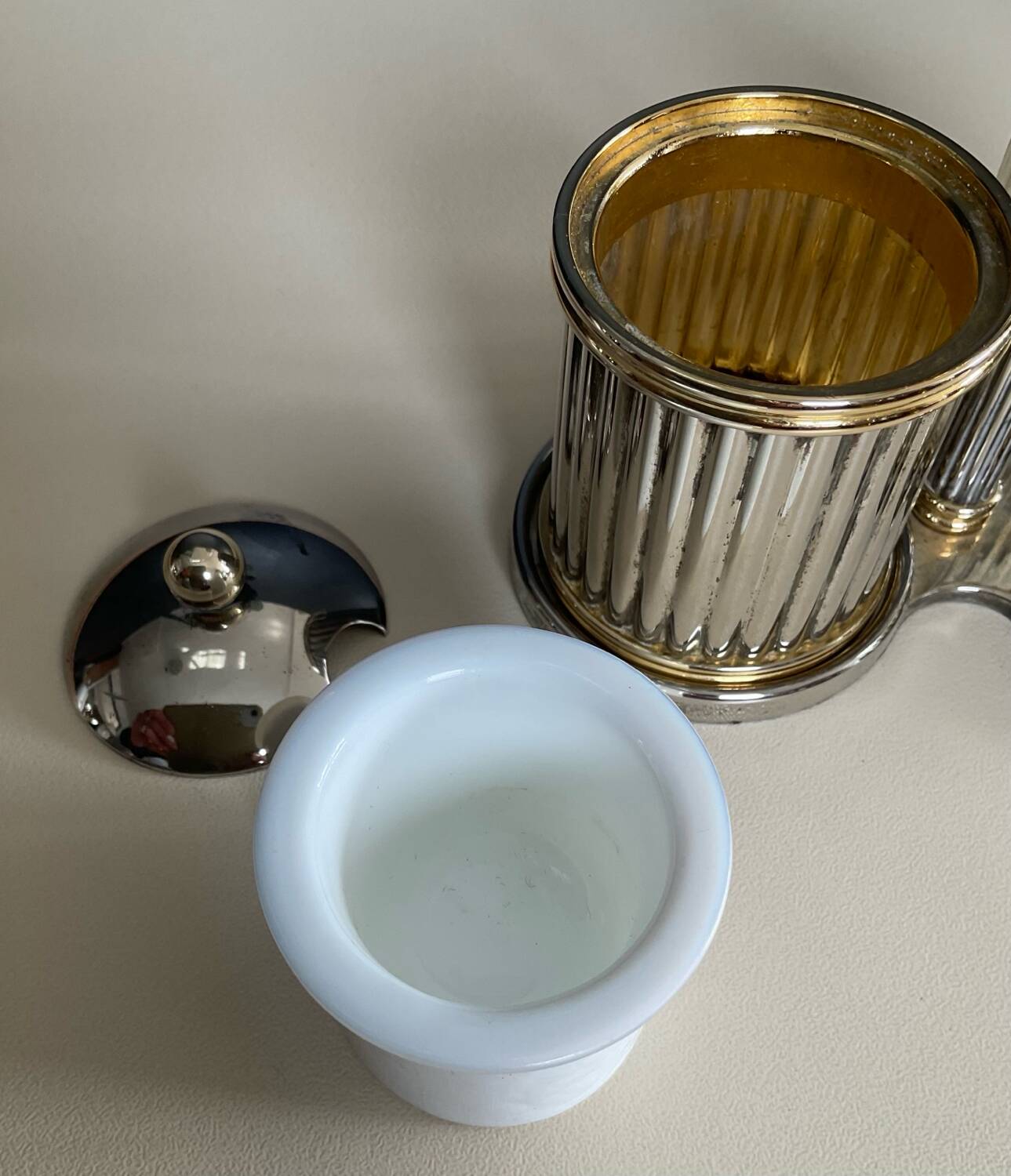 Vintage metal silver-plated and brass salt and pepper set.