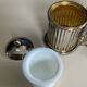Vintage metal silver-plated and brass salt and pepper set.
