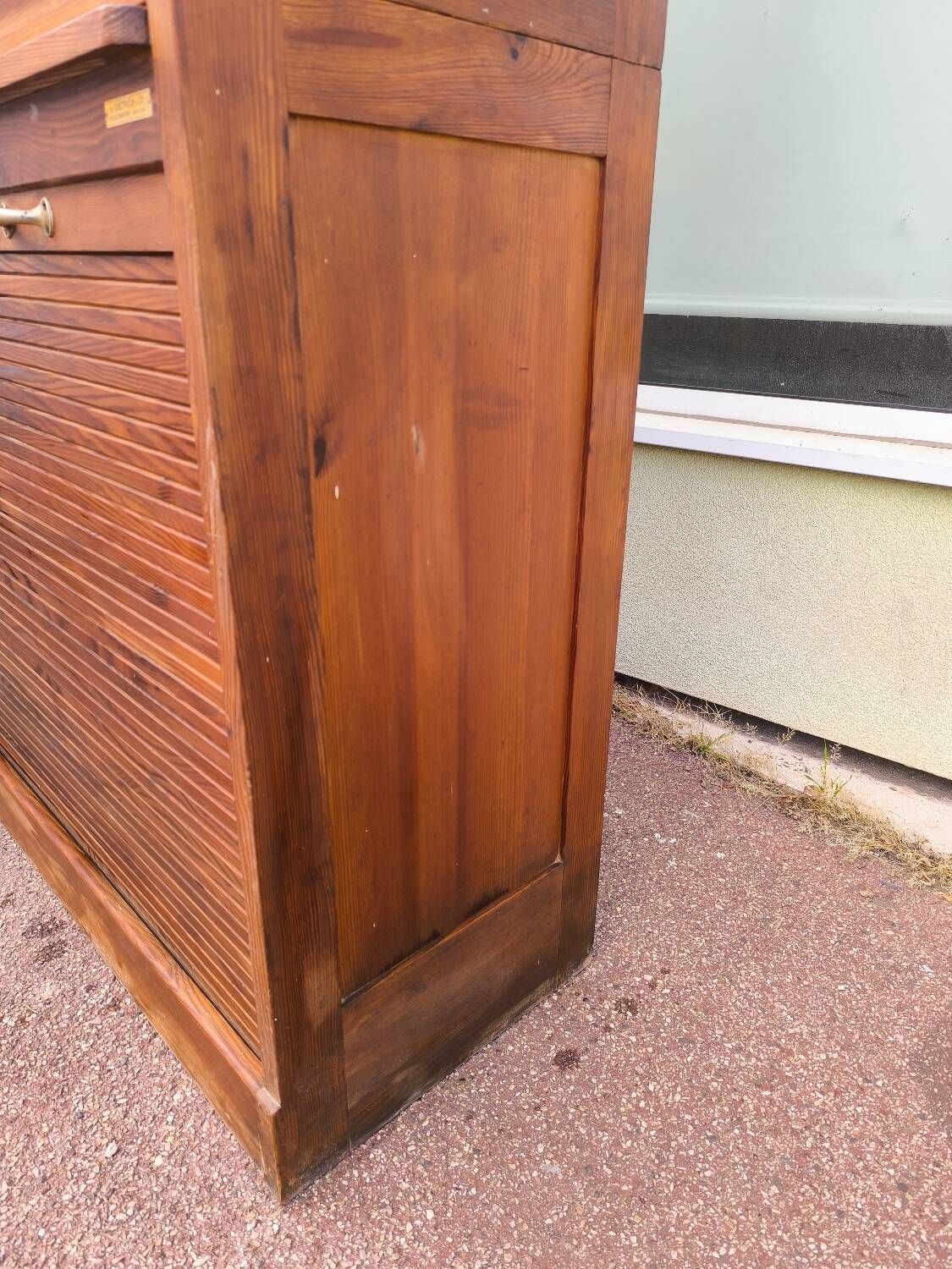 Vintage 1940s secretary desk with wooden curtains, storage, and shutters.
