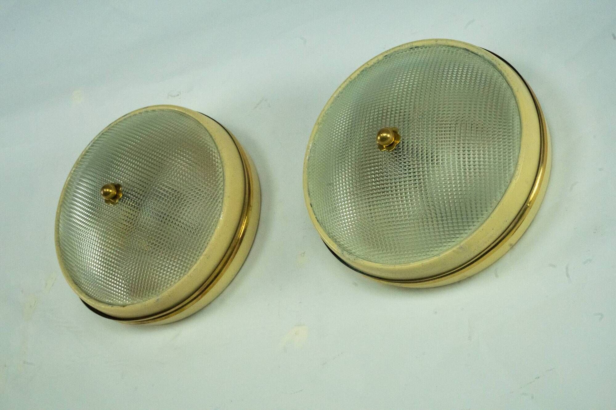 Lumi Milano, pair of wall or ceiling lamps in glass, brass and lacquer, 50s
