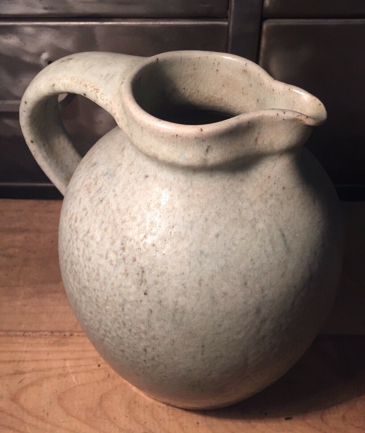 Pitcher in speckled gray enamelled sandstone signed