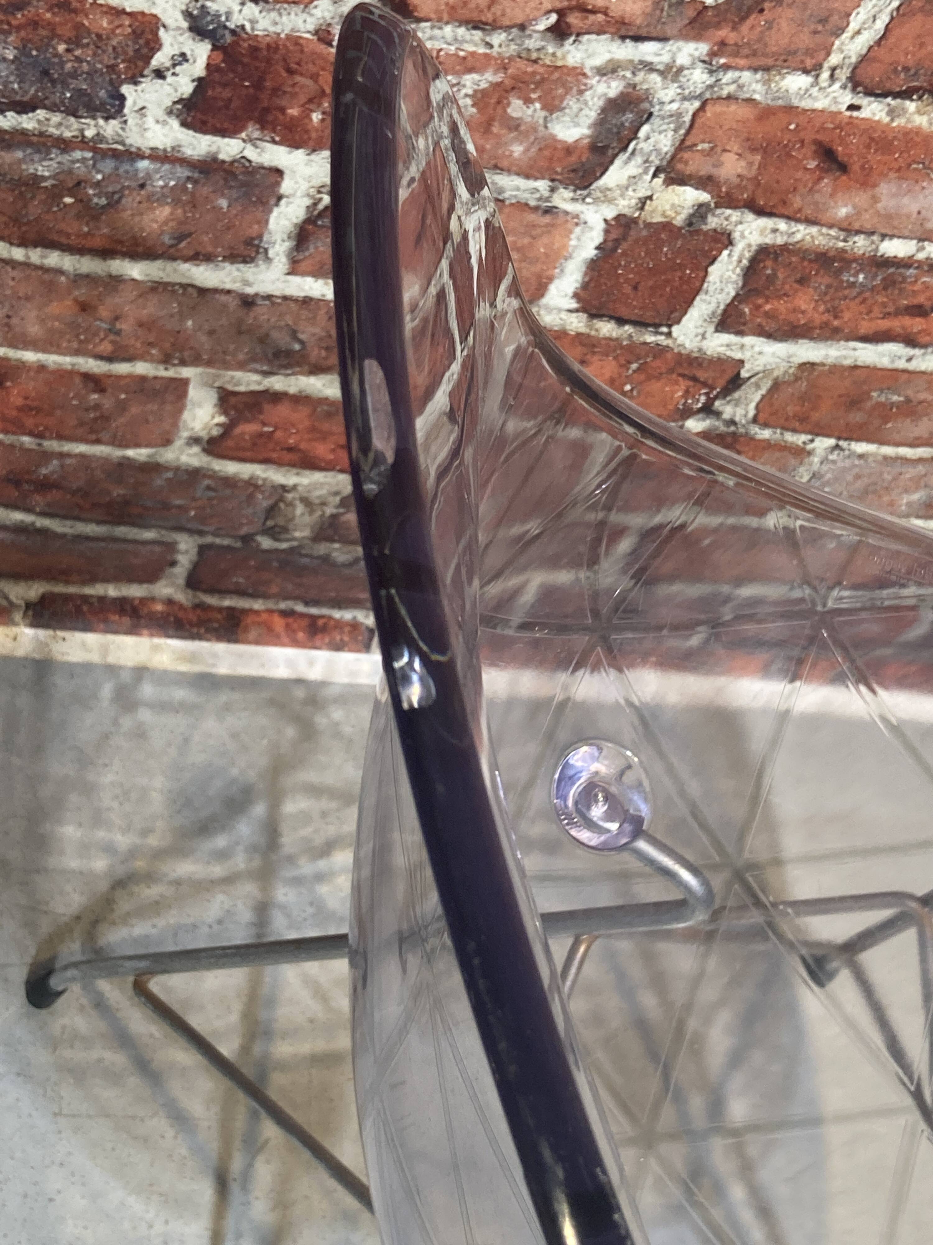 Set of four plexiglass and metal chairs