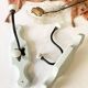 Antique metal and porcelain coat hooks, painted wooden support